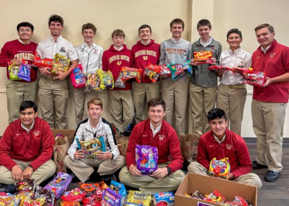 Students with a collected candy drive